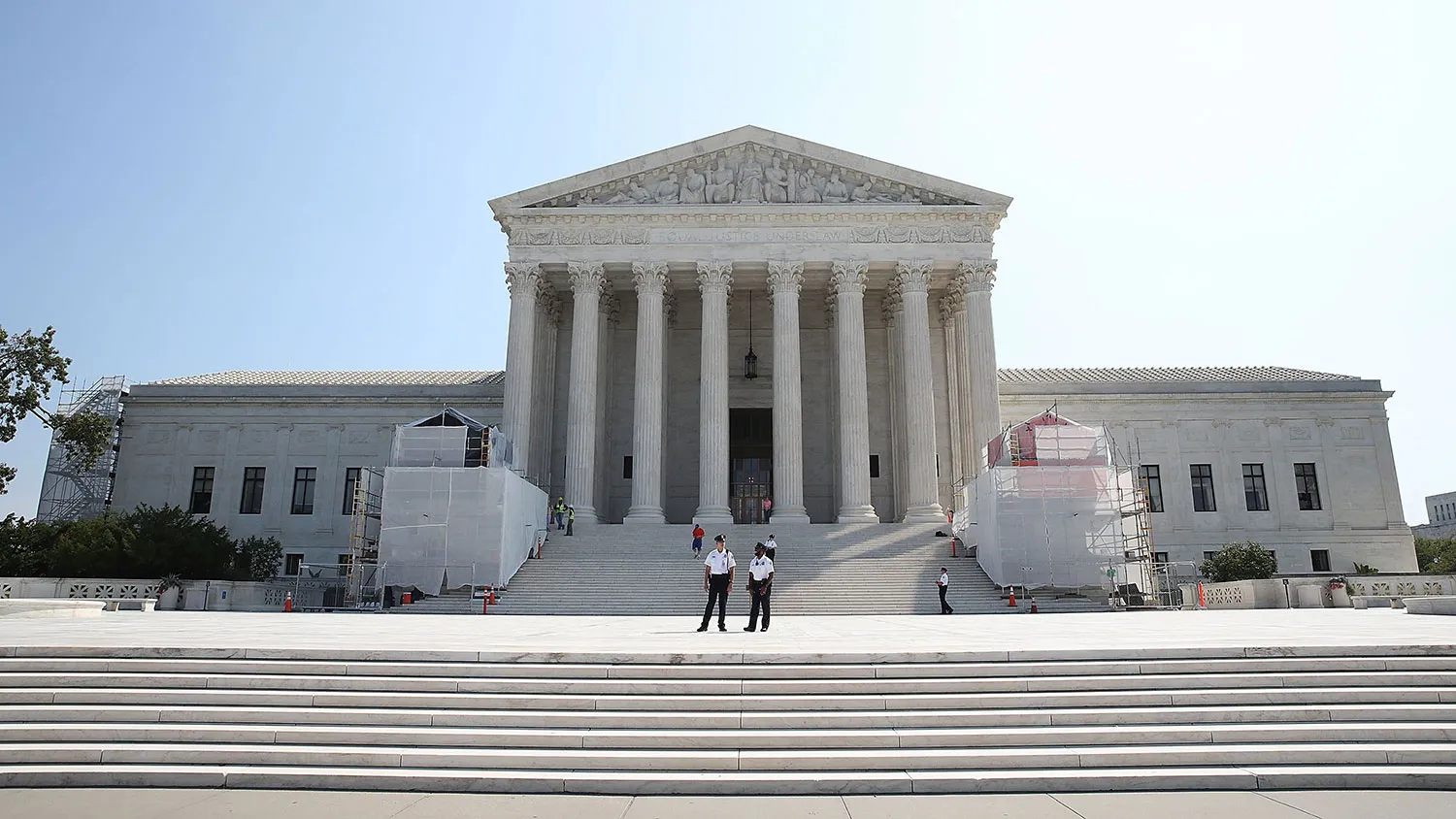 Guards stand in front of the Supreme Court on Sept. 7, 2016, in Washington.
