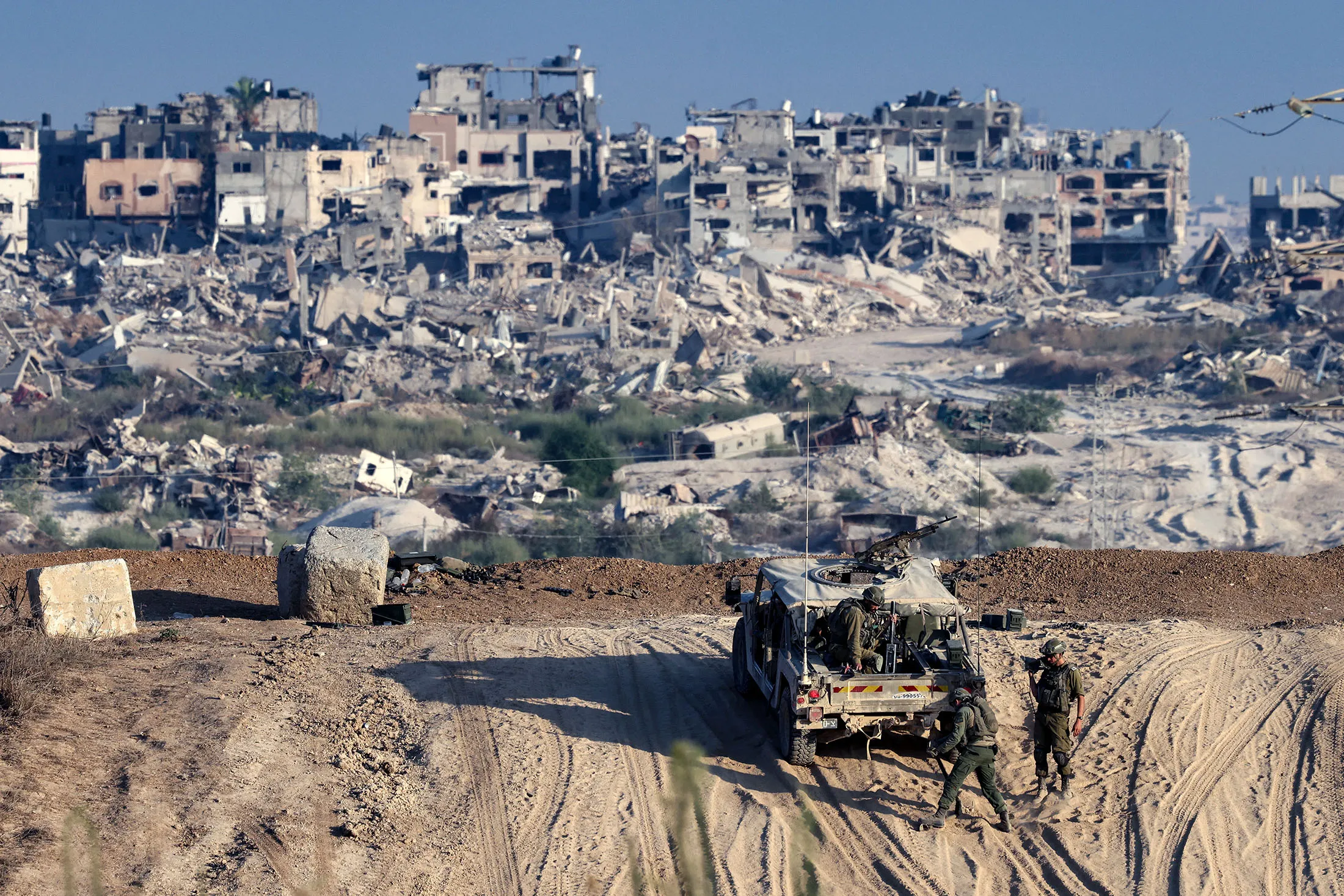 Israeli troops operate on their side of the fence separating Israel from the Gaza Strip on Aug.&nbsp;29.