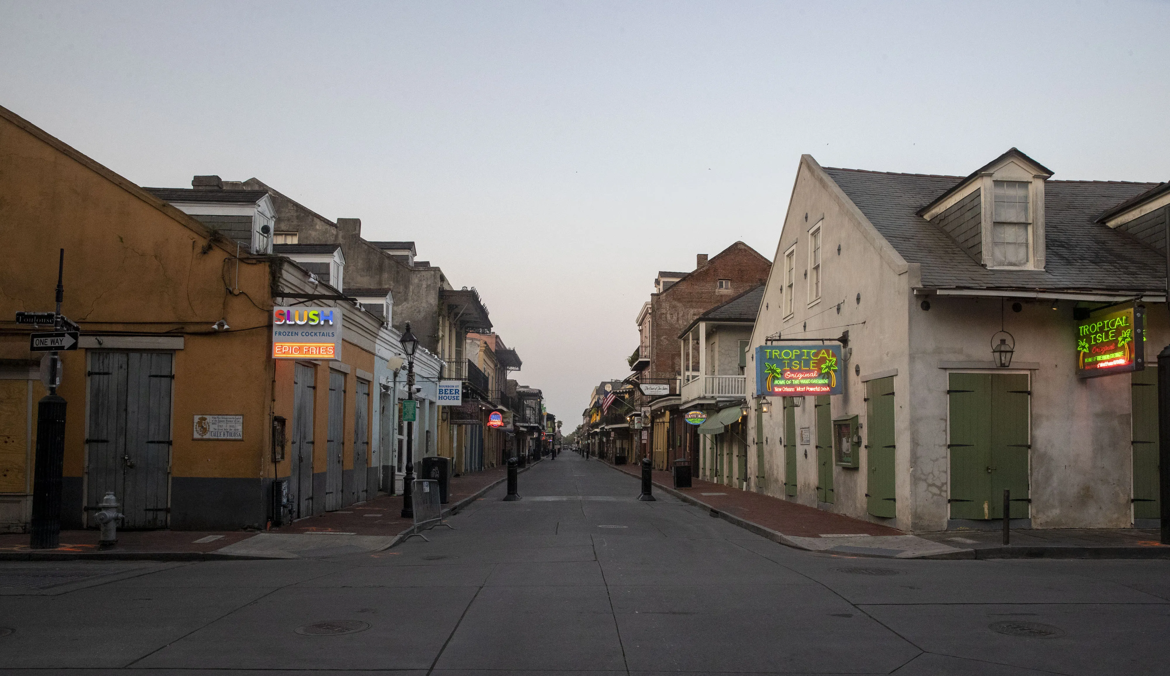 Signs are seen illuminated on closed businesses on Bourbon Street in New Orleans, Louisiana, U.S., on&nbsp;April 8.