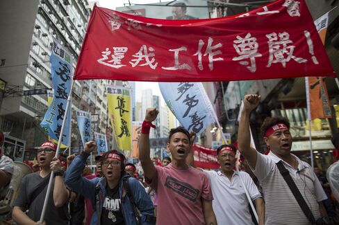 Li Ka-Shing’s Dockers Accept Pay Offer to End Longest Strike