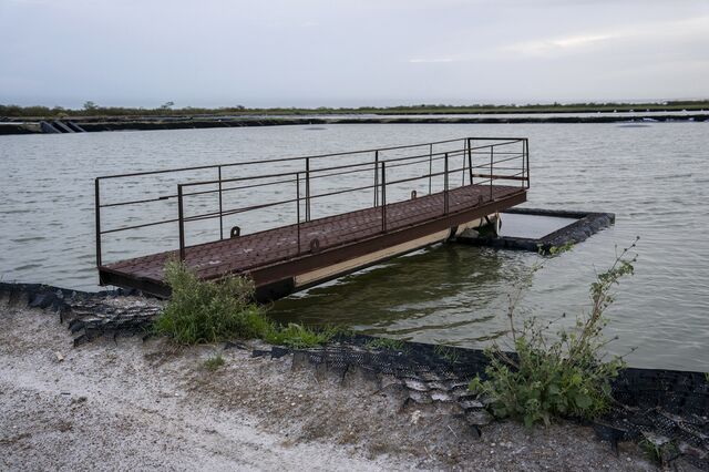 A water pit containing produced water close to a SPOC oil facility. Produced water is a byproduct of the oil production process. 