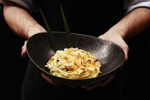 Don't miss the Makhan Malai dessert: saffron-infused milk froth with crunchy sugar and rose petals.