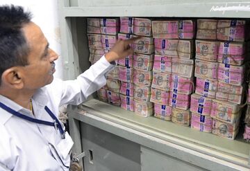 A pile of 1,000 rupee notes in a bank vault in Ahmedabad on Nov. 11. Photographer: Sam Panthaky/AFP via Getty Images