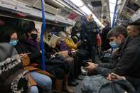 Passengers wearing facemasks as a preventive measure against