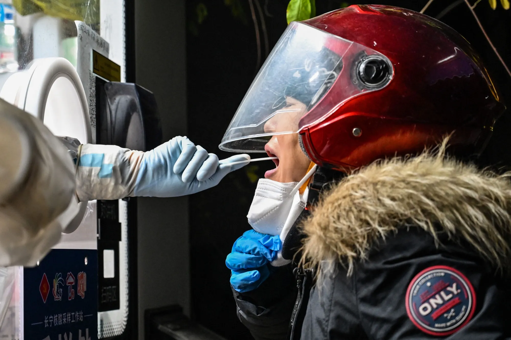 A woman is tested&nbsp;for Covid-19 in Shanghai on Dec. 23.
