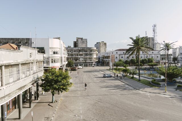Pedestrians walk in the city center of Beira. 