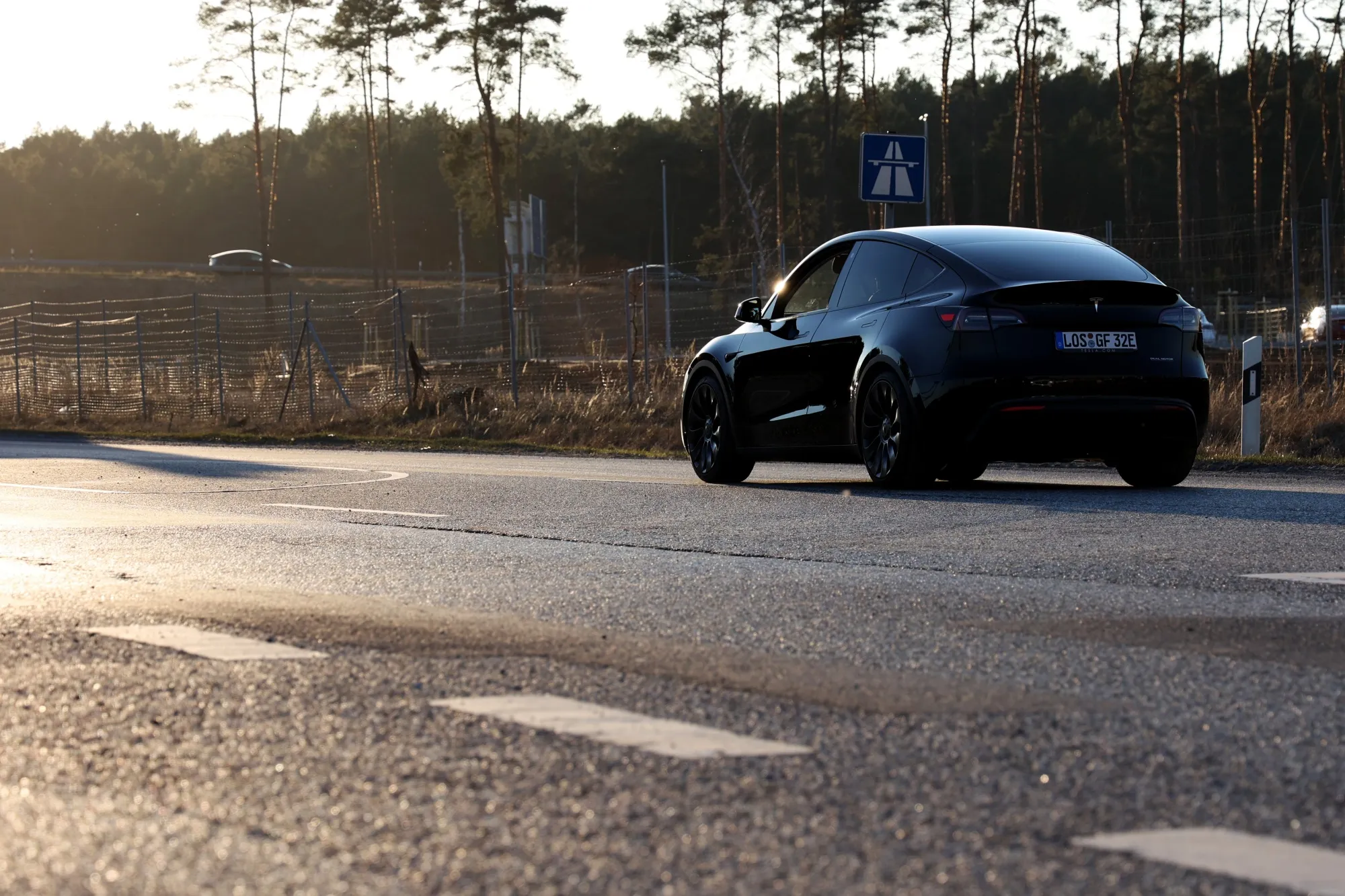 A Tesla departs the automaker's Gigafactory&nbsp;in Gruenheide, Germany.