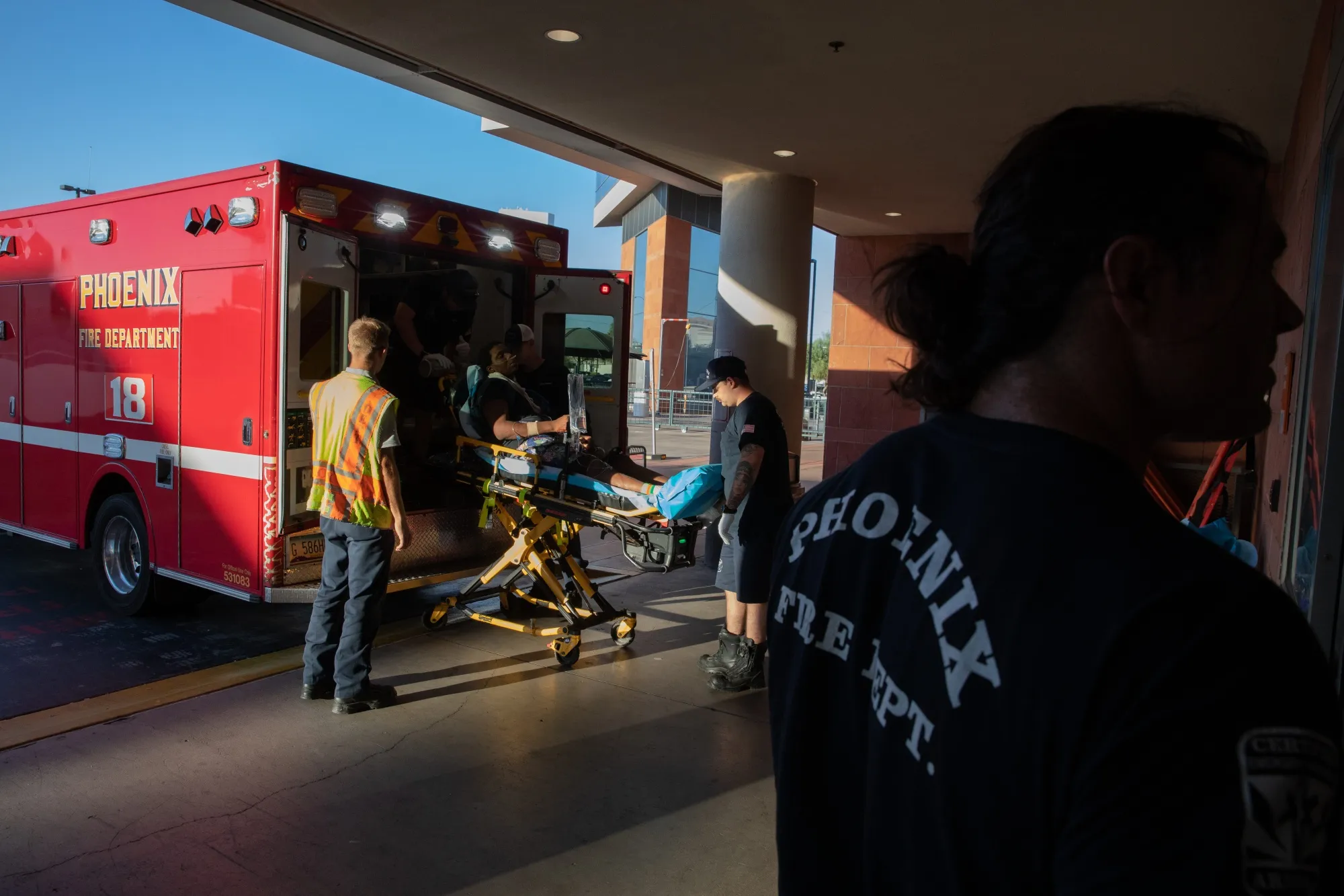 Paramedics from Phoenix Fire Station 18 transport a resident to the hospital during a heat wave in Phoenix, Arizona, on July 20.