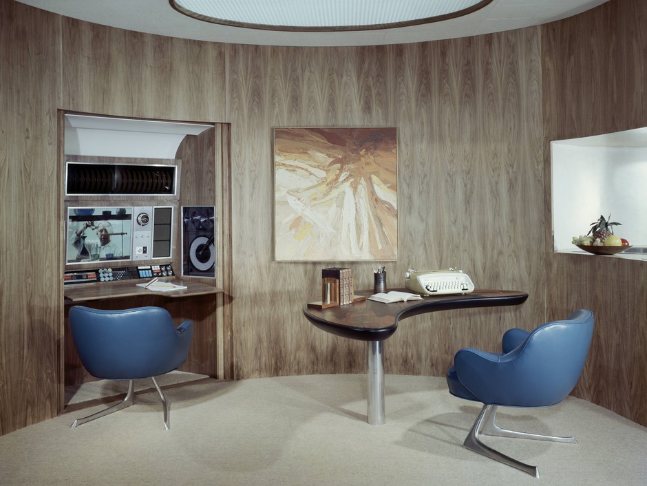 A space-age home office of 1963 boasts a stereo alcove and swoopy aluminum-and-rosewood desk.
