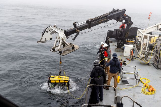 The MiniROV is lowered into the Pacific Ocean.