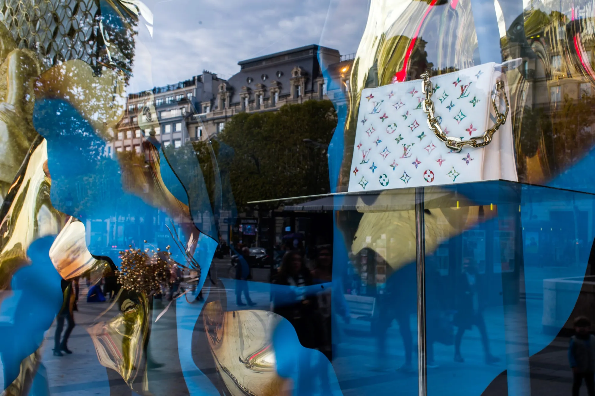Handbags in a window display of the Louis Vuitton luxury goods store on the Champs-Elysee in Paris.