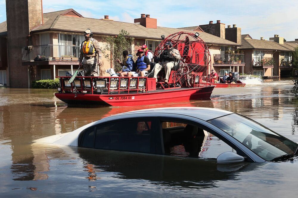 in pictures tropical storm harvey wreaks havoc across texas bloomberg rescue workers and volunteers help to rescue residents of an apartment complex in houston texas on aug 30