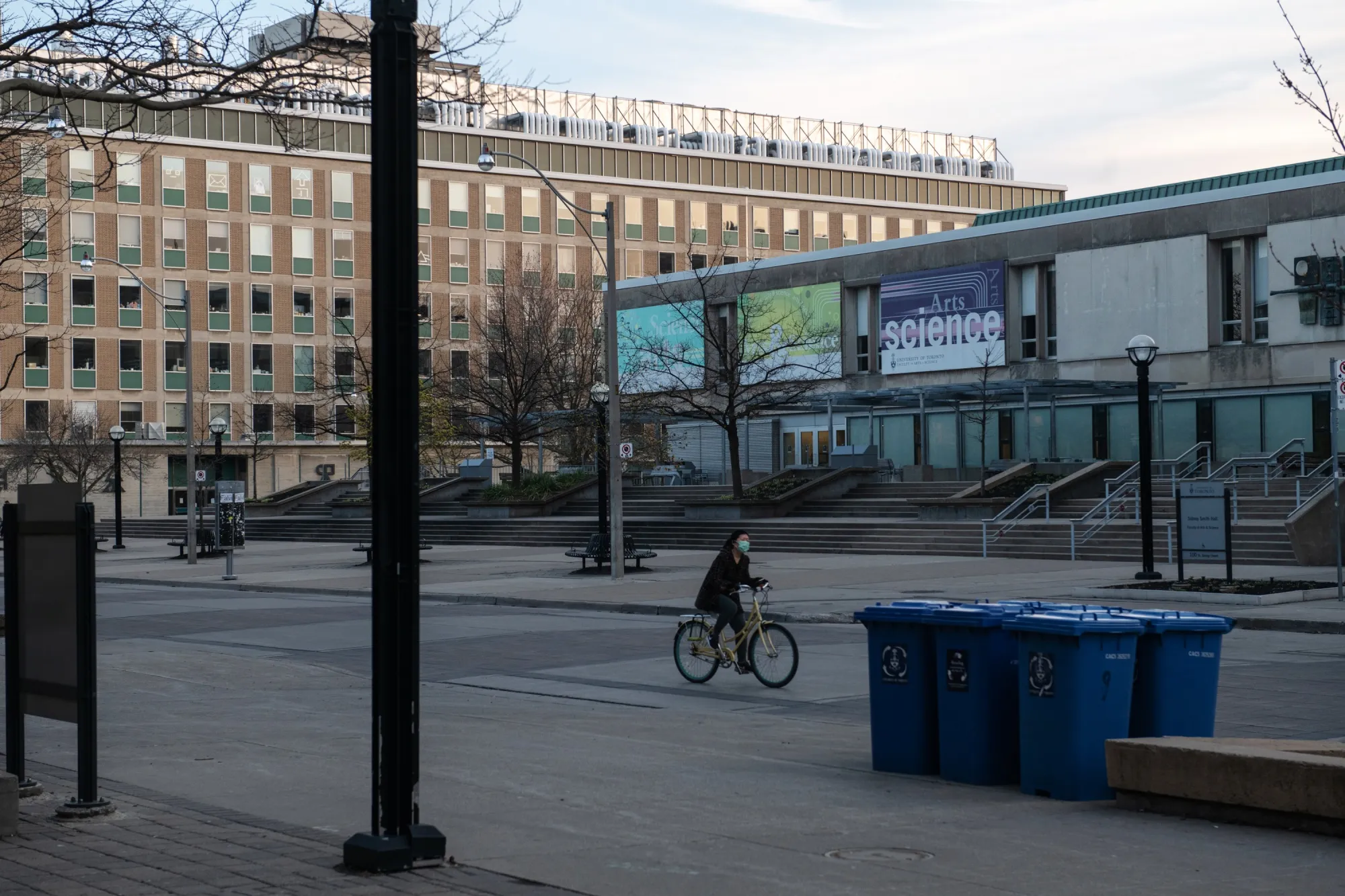 A cyclist bikes through the University of Toronto campus on April 28, 2020.
