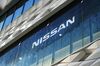 Signage is displayed at the Nissan Motor Co. Nissan Crossing showroom.