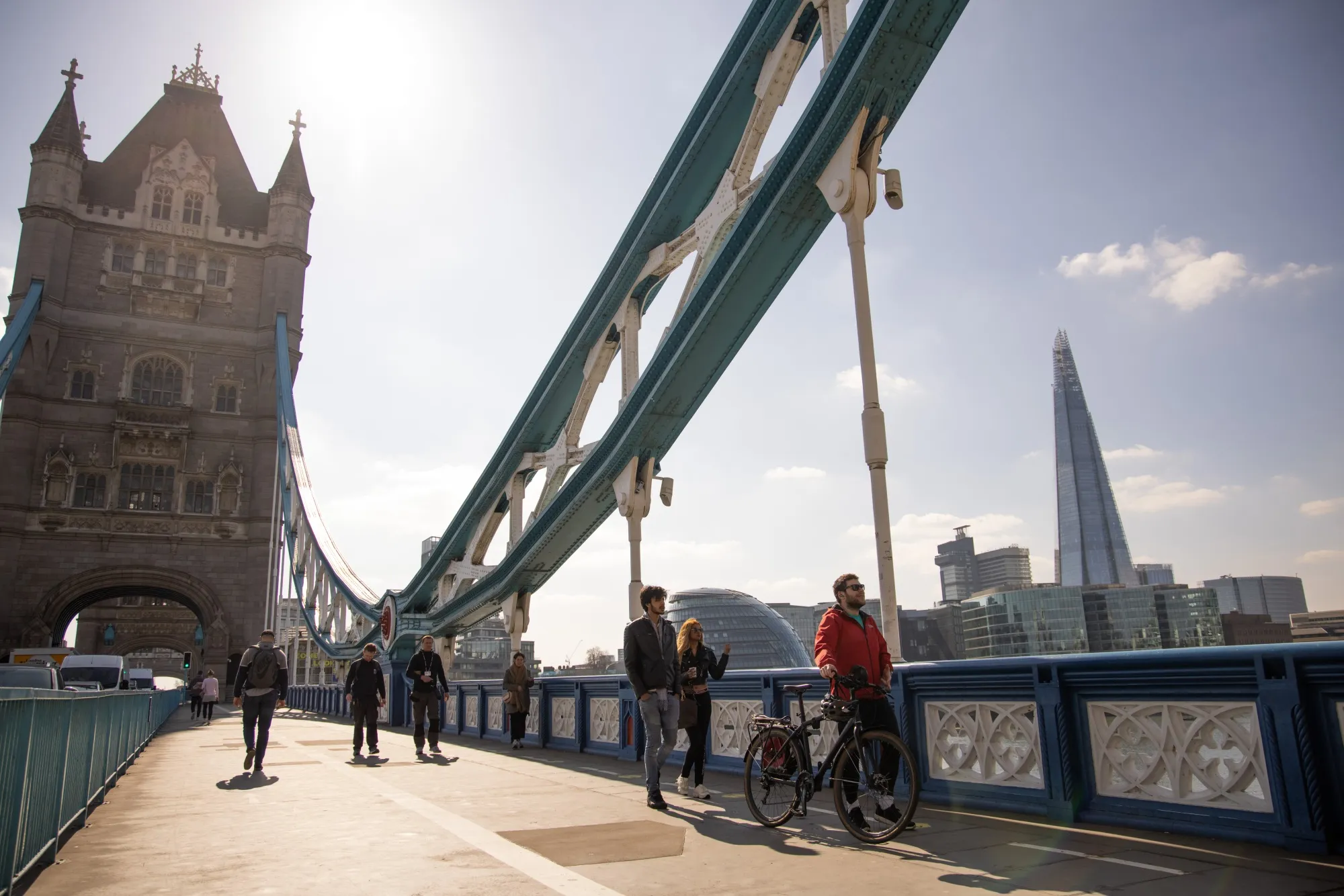Pedestrians cross Tower Bridge in the City of London, on March 22.