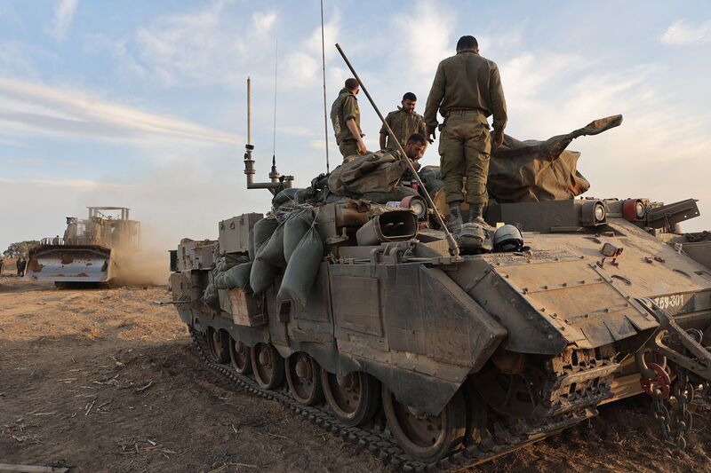 Israeli troops gather near the border before entering the Gaza strip on Oct 29.