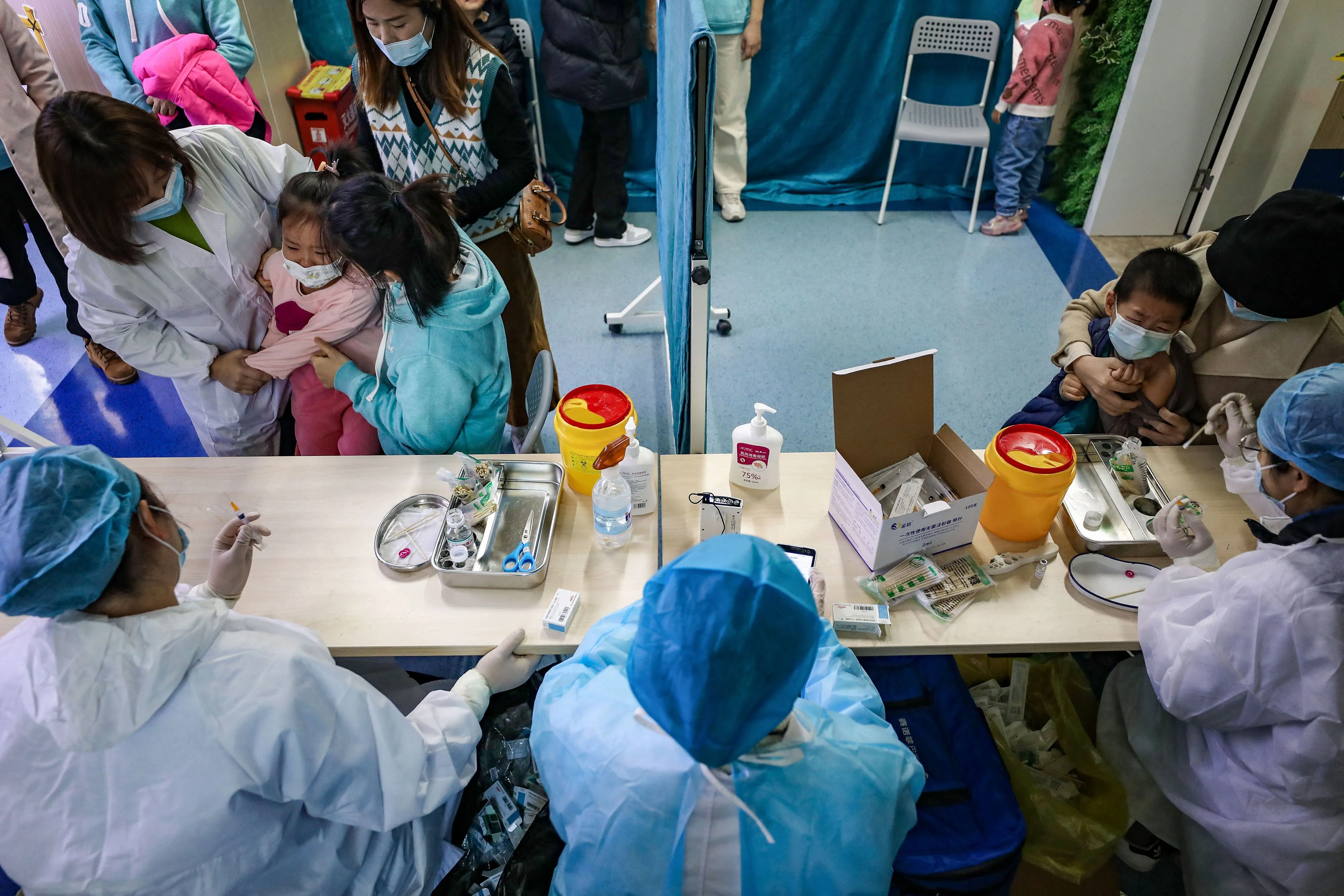 Children receive a Covid-19 vaccine in Wuhan, on Nov. 12.