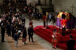 Members of the public file past Queen Elizabeth II's flag-draped casket in Westminster Hall in London, on Sept. 17.&nbsp;