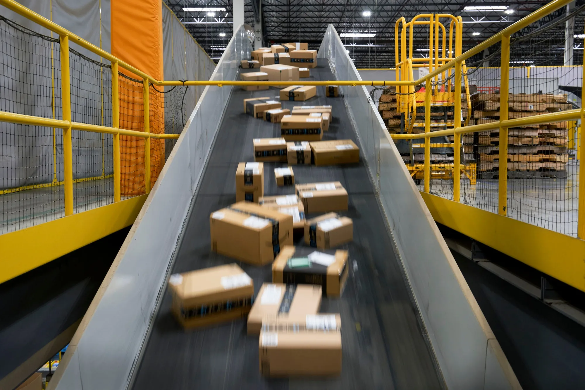 Packages prepared for shipping on a conveyer belt on Cyber Monda.