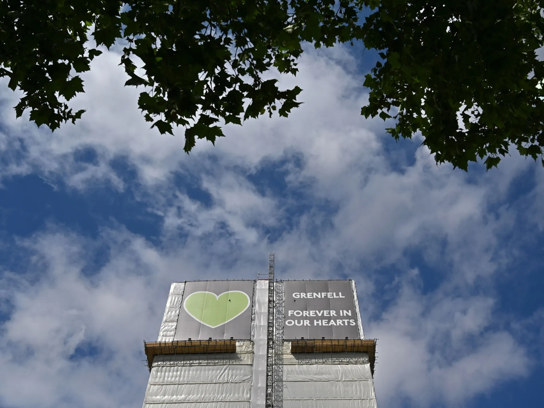 Grenfell tower covered in a tarpaulin in London in 2020.