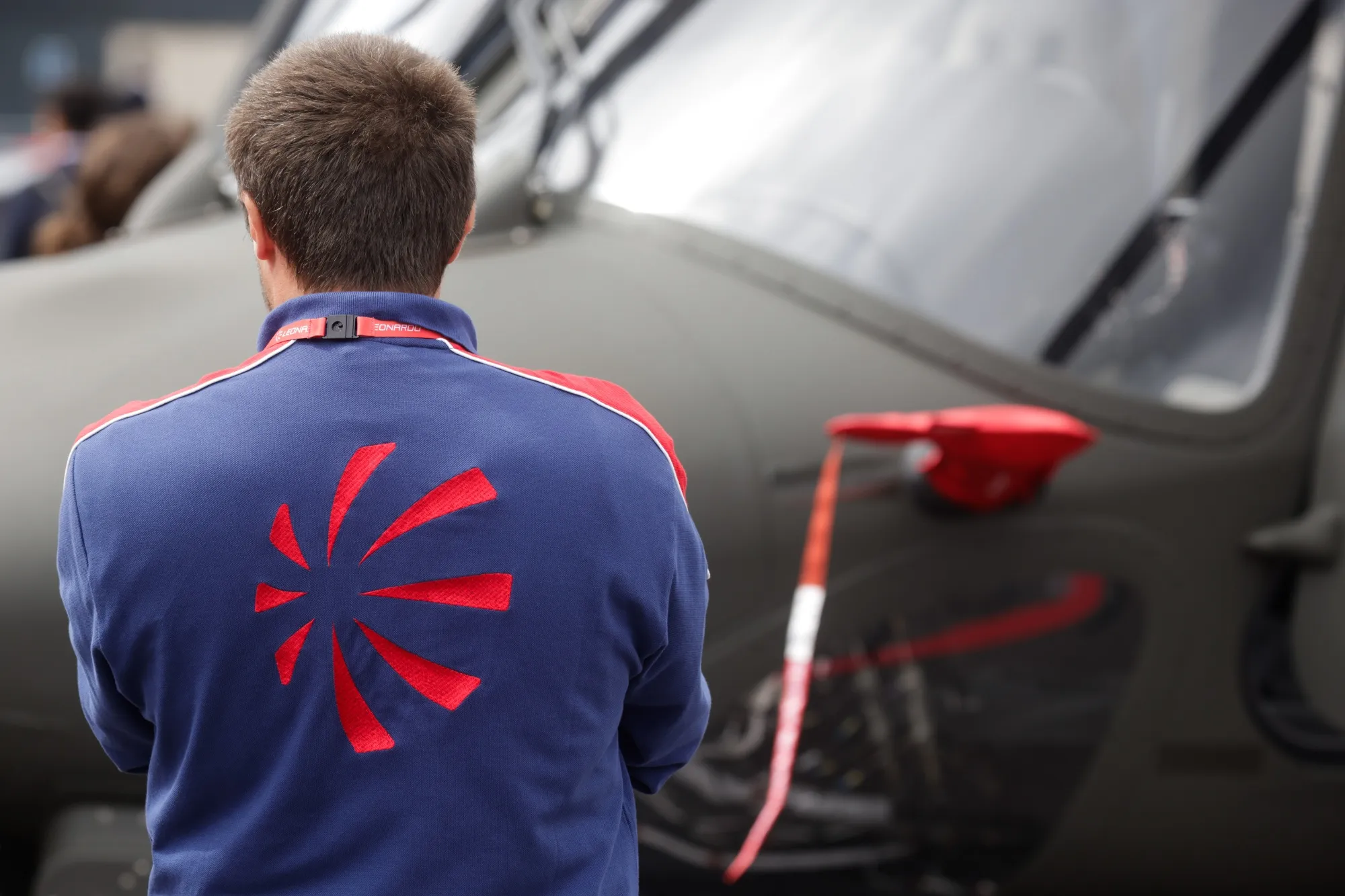 An employee on the Leonardo SpA stand during the opening day of the 2024 Farnborough International Airshow in Farnborough, UK.