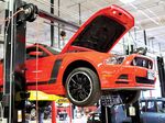 At its Houston facility, Vroom preps a Ford Mustang for sale.
