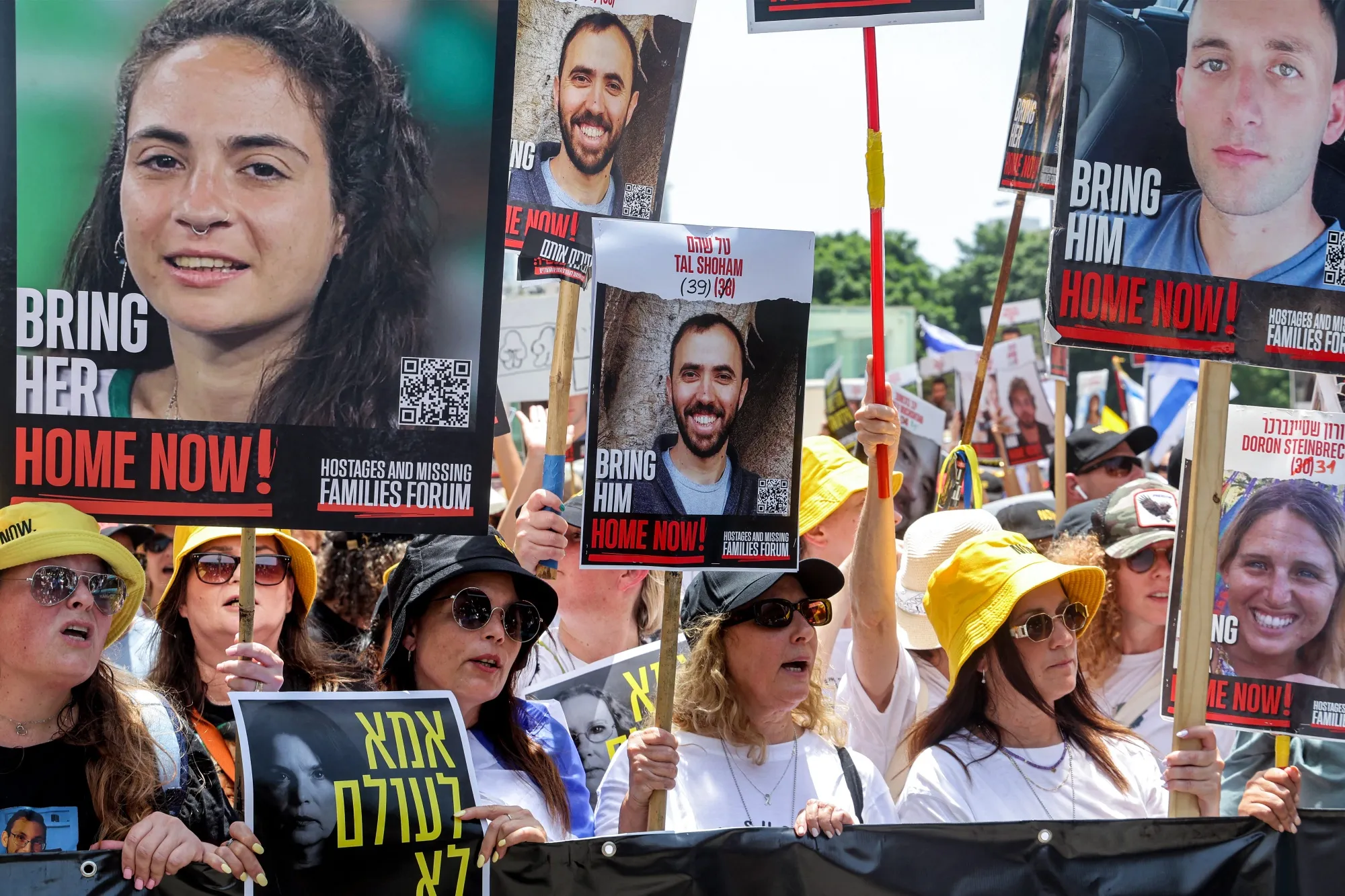 Demonstrators march during a protest by relatives of Israelis held hostage by Palestinian militants in Gaza since the October 7 attack in Tel Aviv on July 5.