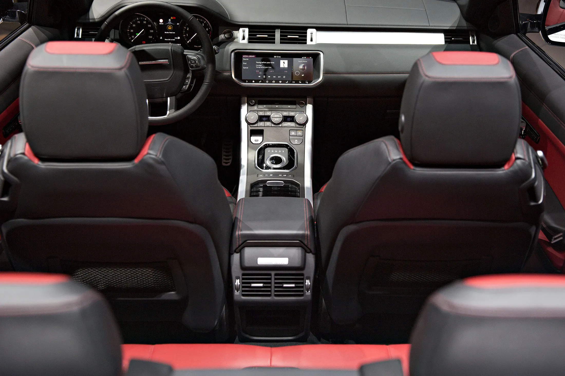 The interior of a Jaguar Land Rover Automotive Plc 2017 Range Rover Evoque convertible sports utility vehicle (SUV) is seen during the Los Angeles Auto Show in Los Angeles, California, U.S., on Wednesday, Nov. 18, 2015. The soft-top Evoque looks nearly exactly like the original, except for a few minor aesthetic changes on the front and some additional cool technology features inside. It is meant to combine the durability and practicality of an SUV with the elan of a convertible.
