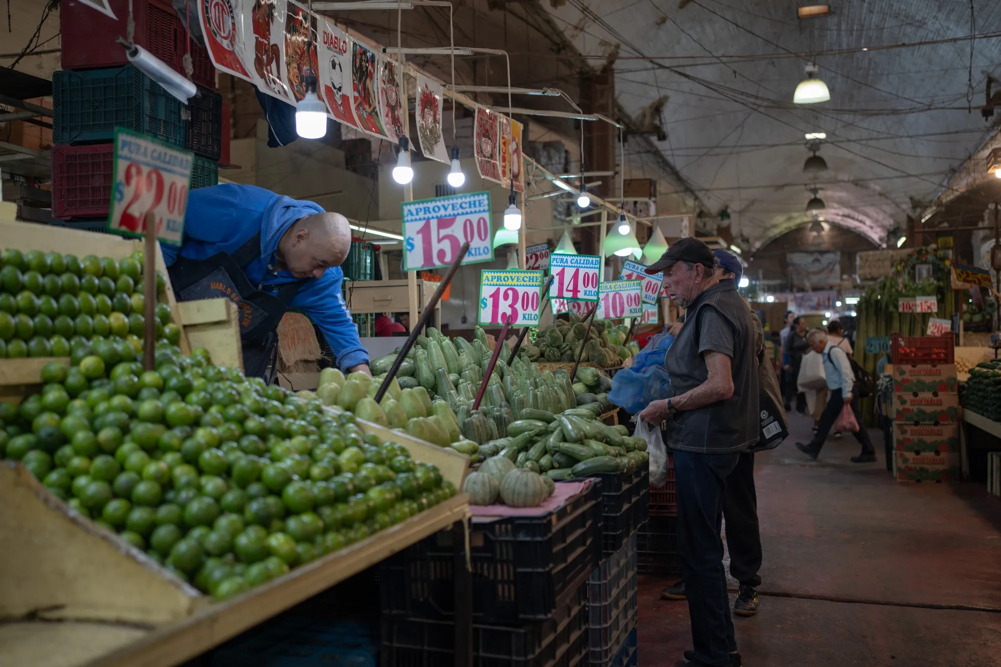 Shoppers browse produce at the La Merced market in Mexico City, Mexico.