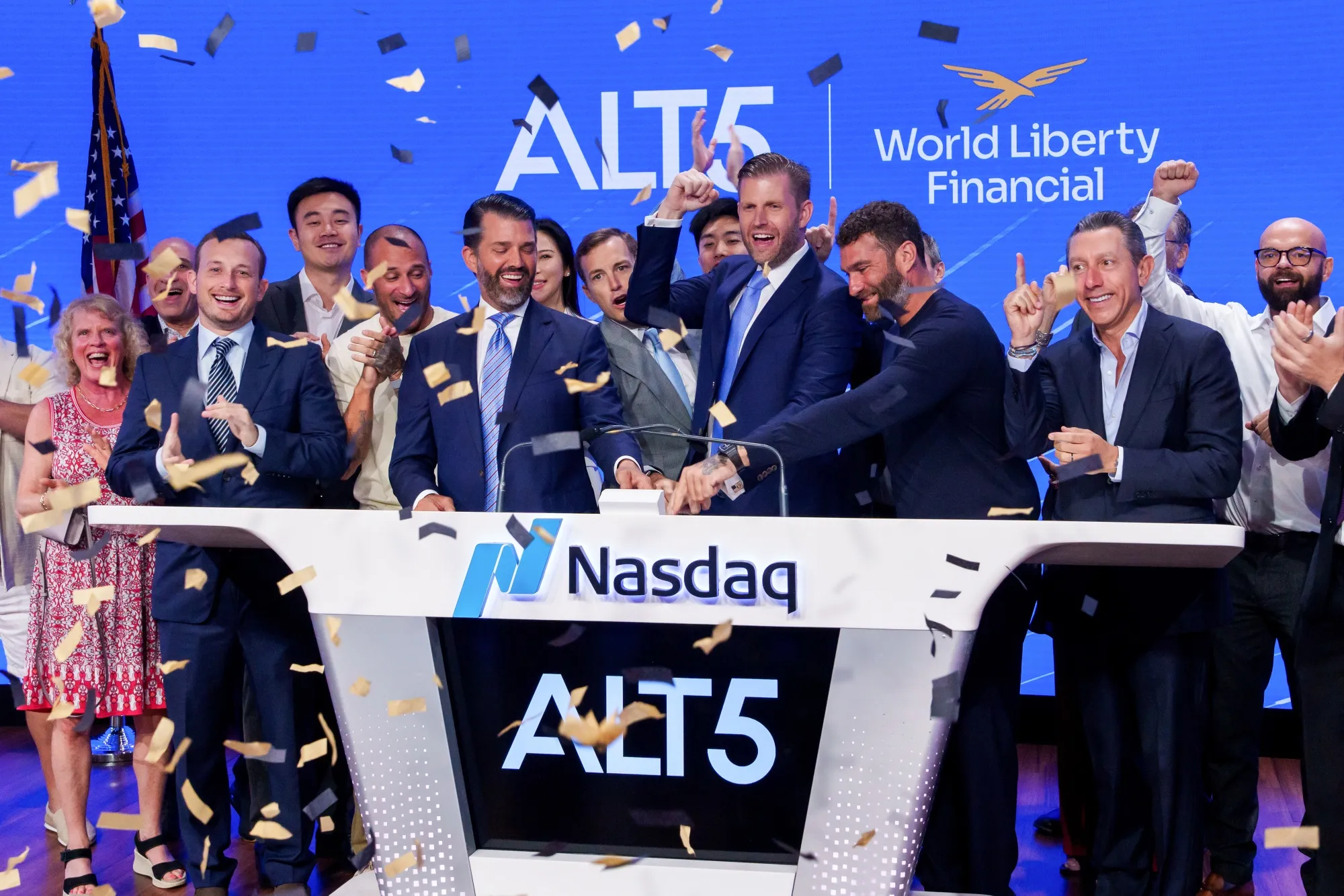 Donald Trump Jr., center left, and Eric Trump, center right, ring the opening bell at the Nasdaq MarketSite in New York on Aug. 13.