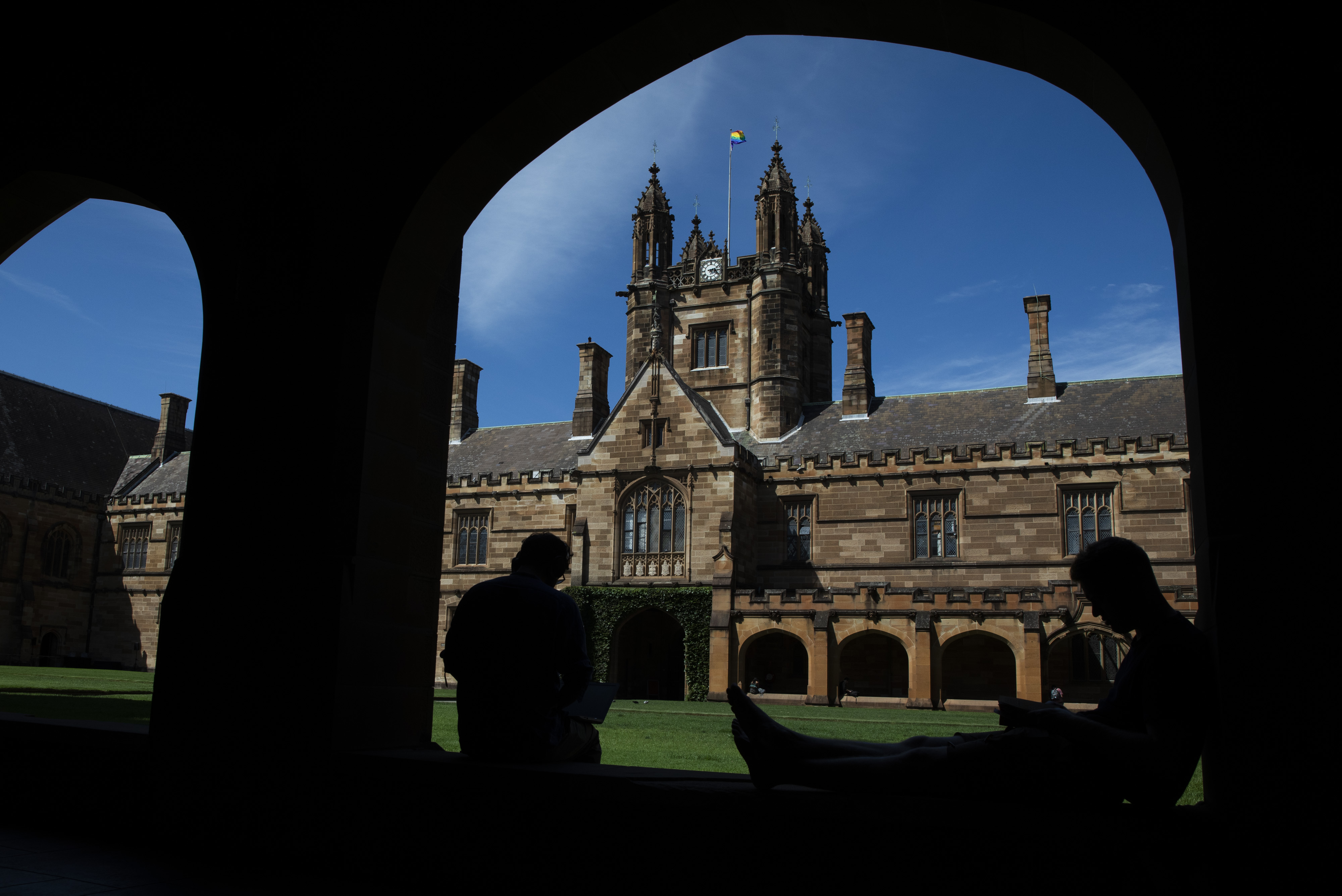 Students sit in the cloister of the quadrangle at the University of Sydney on Feb. 25.