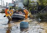 Fire department workers evacuate residents from a flooded area in Date, Fukushima prefecture on October 13, 2019, one day after Typhoon Hagibis swept through central and eastern Japan.