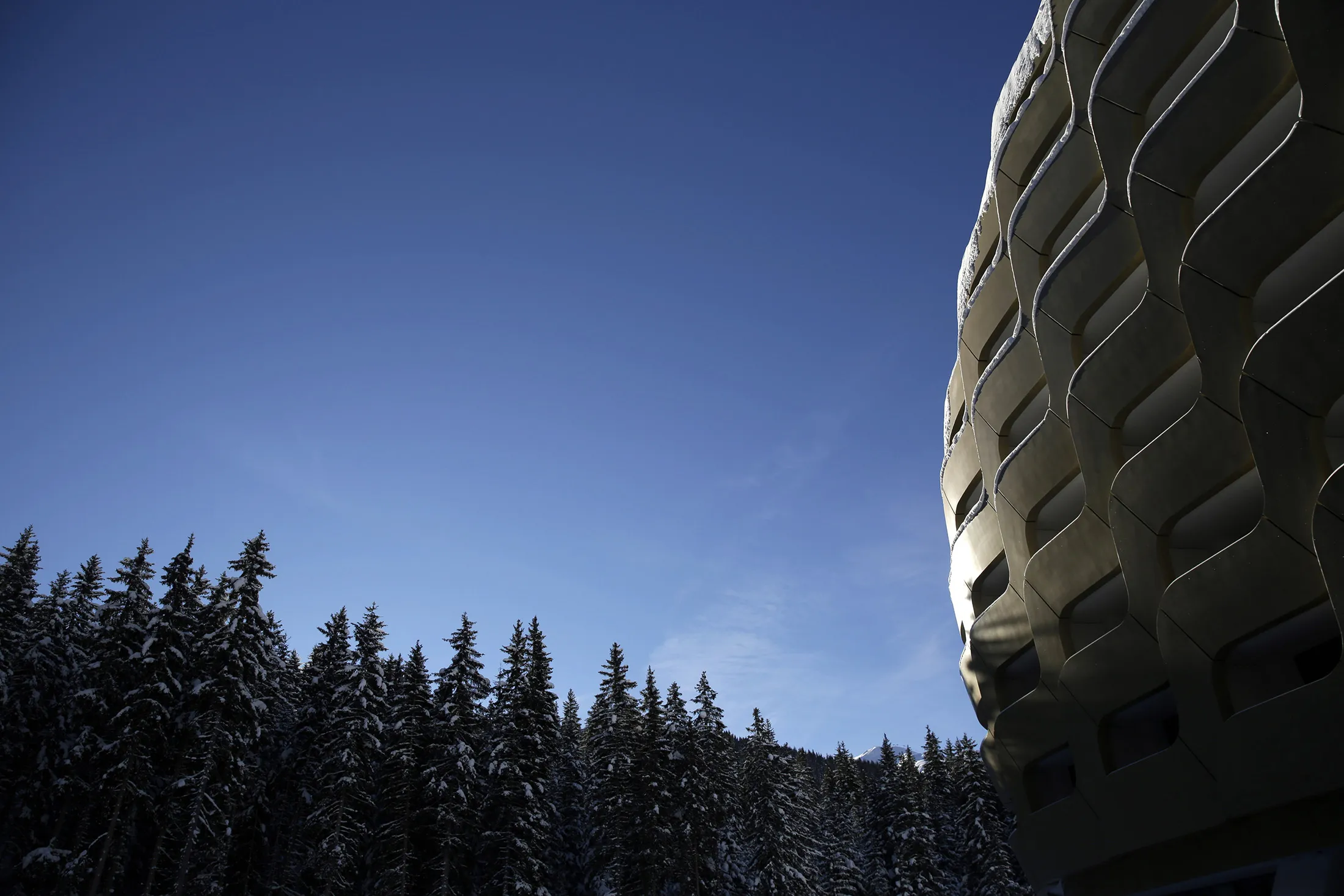Sunlight reflects off of the gold coloured dome of the InterContinental Hotel Davos, operated by InterContinental Hotels Group Plc (IHG), ahead of the World Economic Forum (WEF) in Davos, Switzerland, on Monday, Jan. 18, 2016. World leaders, influential executives, bankers and policy makers attend the 46th annual meeting of the World Economic Forum in Davos from Jan. 20 - 23.
