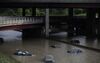 After some of the worst flash flooding in decades, vehicles sit submerged in water along I-75 outside of Detroit, Michigan, 2014.
