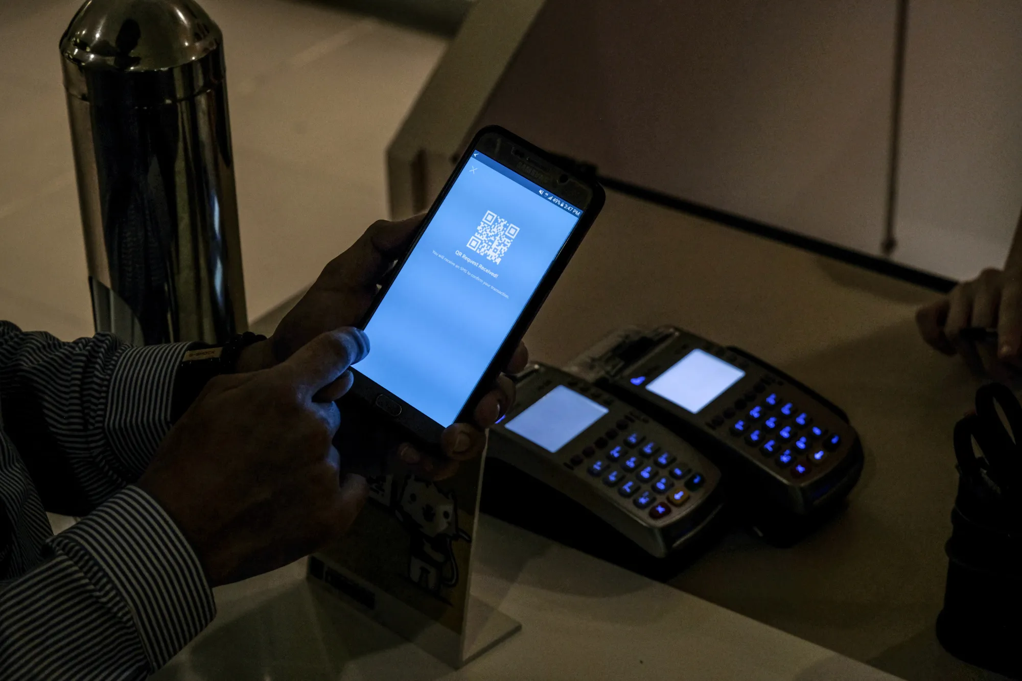 A customer uses the GCash mobile payment application.