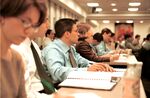 Students attend Dr. Carl Crego's lecture during a Chartered Financial Analyst (CFA) class offered by The Education Department of the New York Society of Security Analysts (NYSSA) at the World Trade Center in New York Monday evening January 31, 2000.