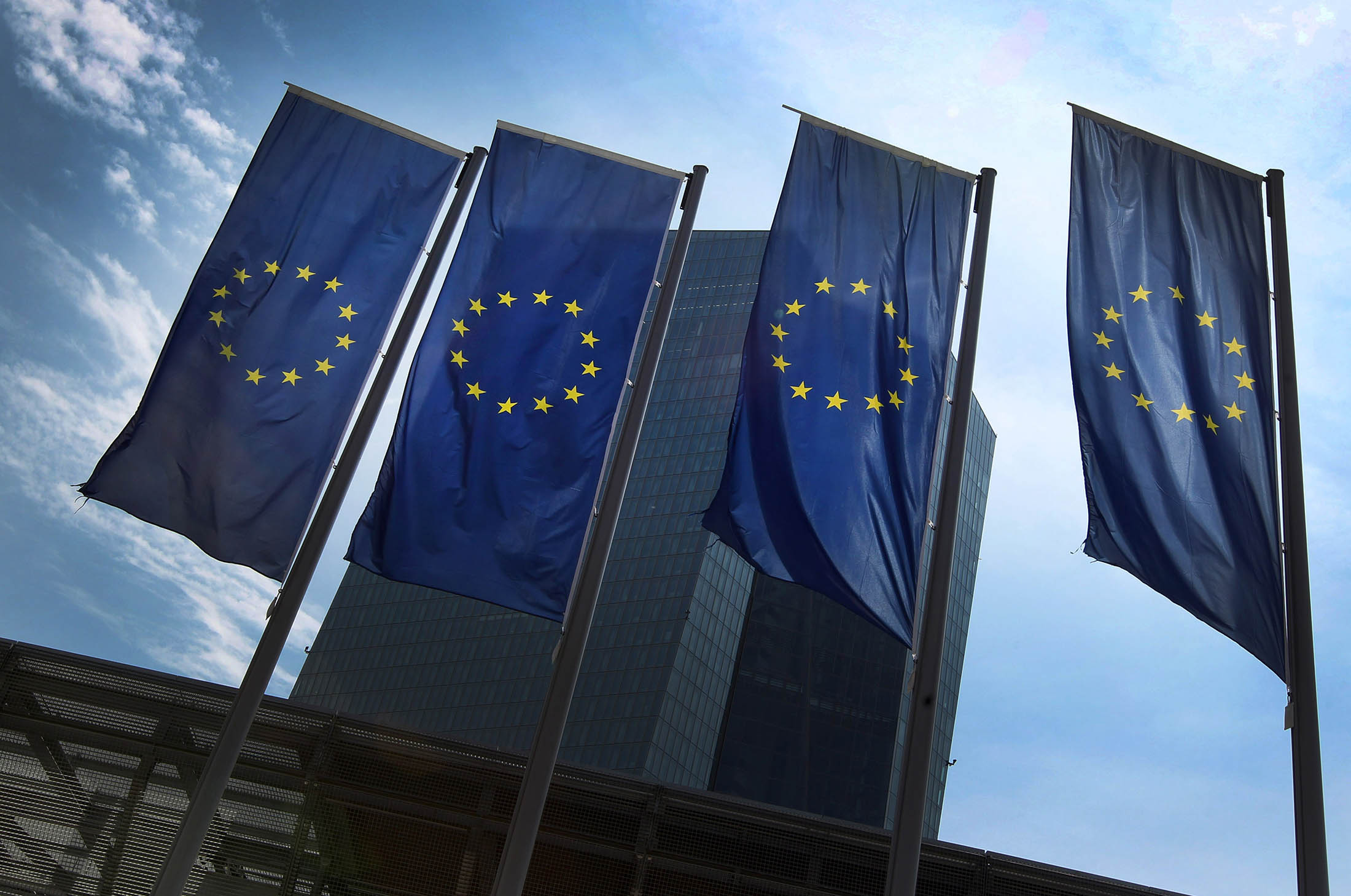 European flags are on display in front of the headquarters of the European Central Bank (ECB) in Frankfurt am Main, western Germany, on June 29, 2015. After talks between Athens and its creditors broke down, leaving Greece headed for an EU-IMF default and possible exit from the eurozone, the ECB said on June 28, 2015 it would keep open Emergency Liquidity Assistance (ELA) to the debt-hit country's banks. AFP PHOTO / DANIEL ROLAND (Photo credit should read DANIEL ROLAND/AFP/Getty Images)
