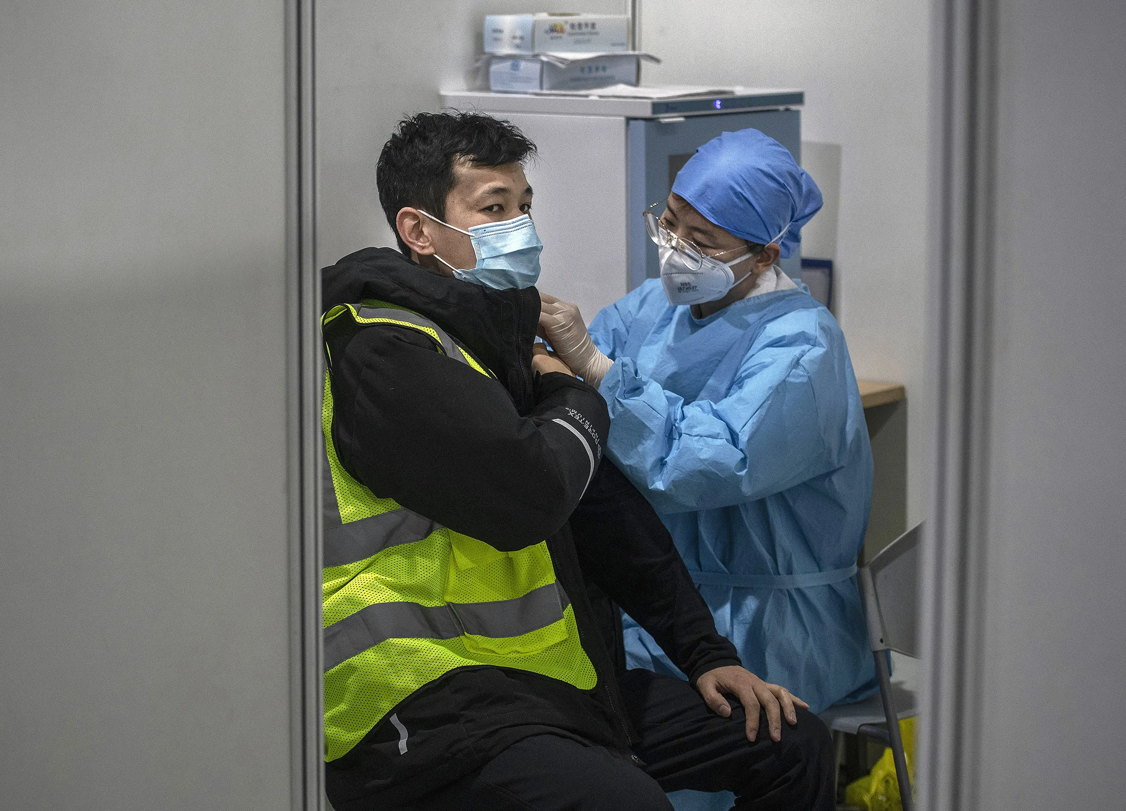 A health care worker administers a Covid-19 vaccine at a mass vaccination center in Beijing, on Jan. 15.