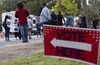 Voters line up for early voting ahead of the 2020 general election at a Fulton County mobile voting station.