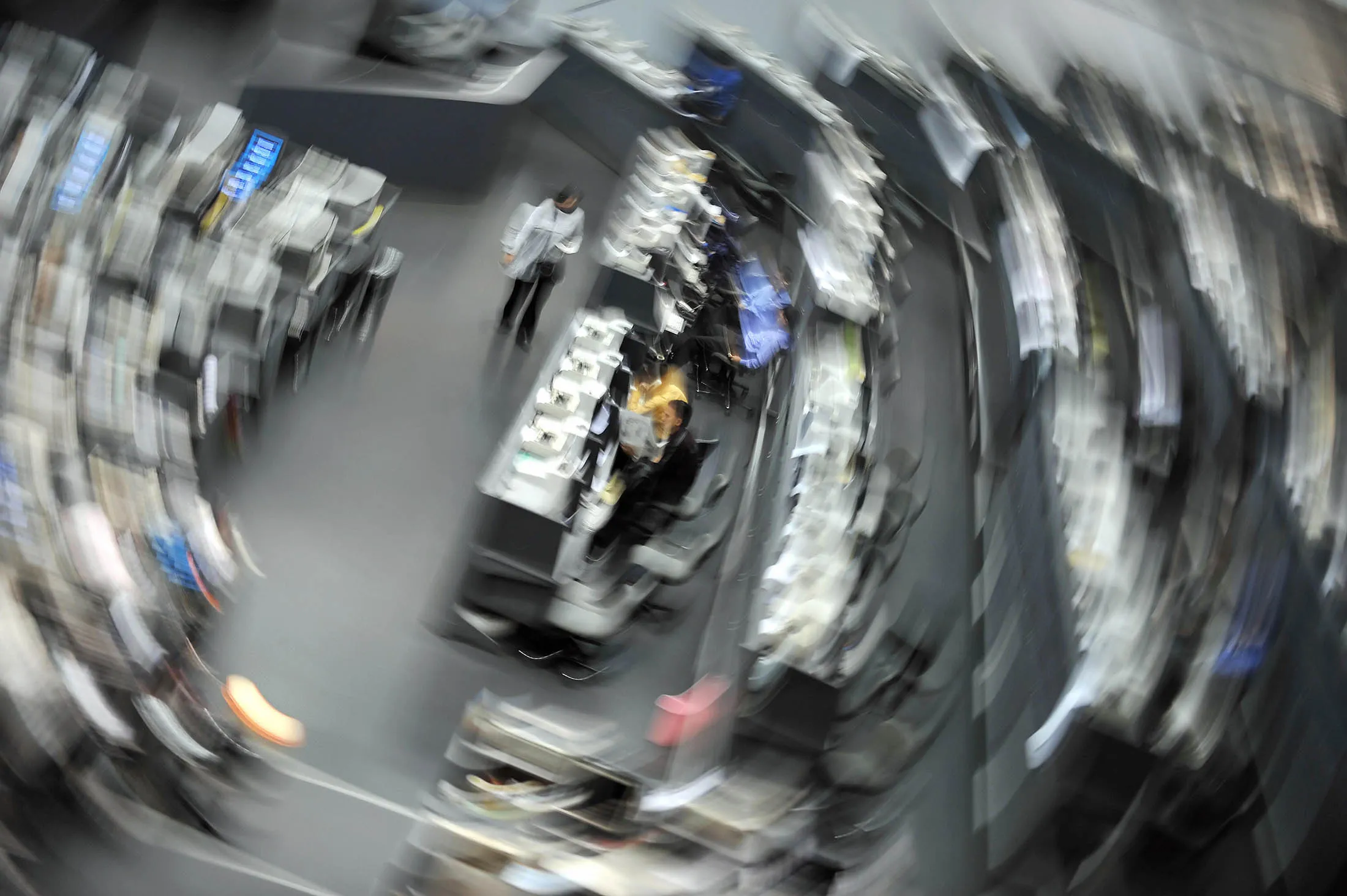 This slow shutter effect photograph shows traders waiting as the Indonesian Stock Exchange closed their trading activities in Jakarta on October 9, 2008. The Indonesian Stock Exchange suspended trading for a second straight day following a drop of more than 10 percent amid a rout in global markets. The exchange suspended trading for only the second time in its history after the main index plunged 10.4 percent. AFP PHOTO/Bay ISMOYO (Photo credit should read BAY ISMOYO/AFP/Getty Images)
