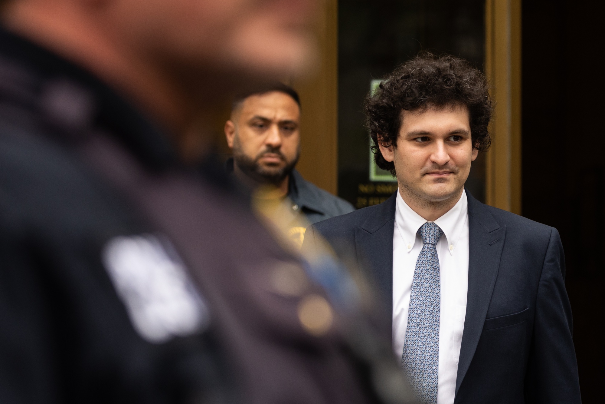 Sam Bankman-Fried leaves court in New York, US, on June 15.