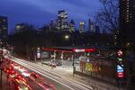 Vehicles pass a Texaco petrol station in London. 