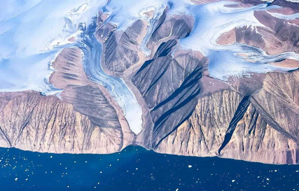 An aerial view of icebergs and ice sheet near Pituffik, Greenland, in July 2022.