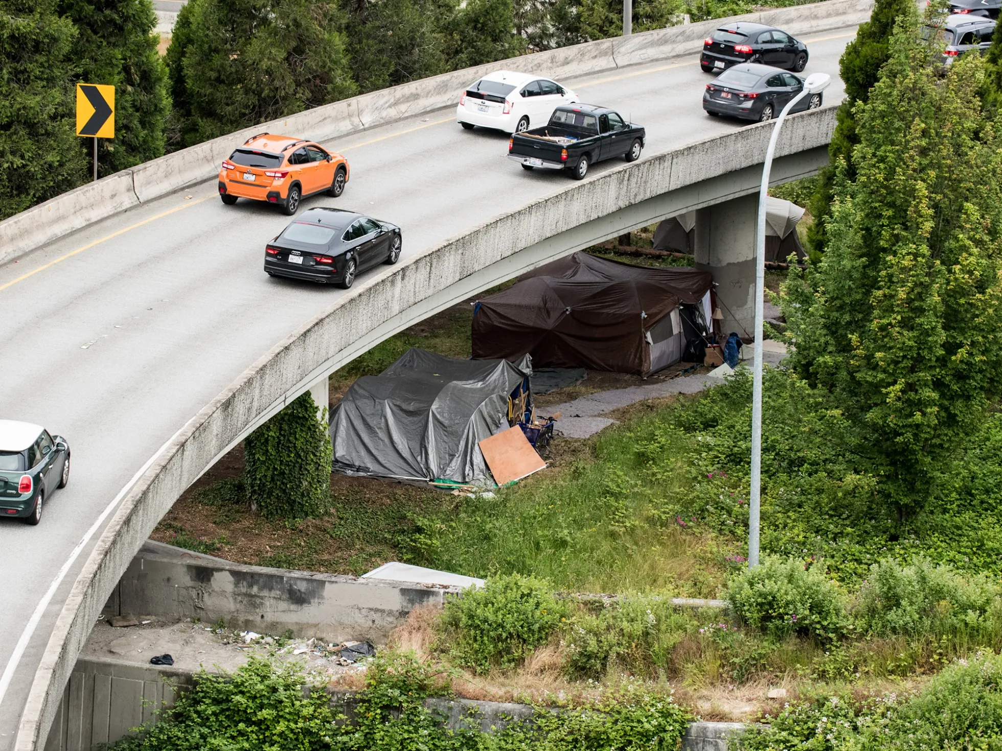 Makeshift tent encampments sit under a highway in Seattle, Washington.