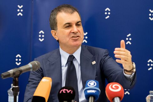 Omer Celik speaks to journalists in Bratislava on Sept. 3.