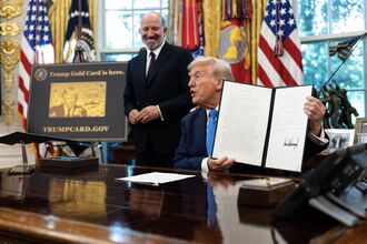 President Donald Trump signs a proclamation instituting a $100,000 fee for visas given to some highly skilled foreign workers in the Oval Office of the White House in Washington, Sept. 19, 2025. (Tierney L. Cross/The New York Times)