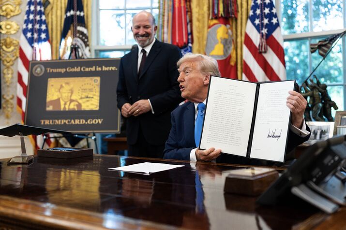 President Donald Trump signs a proclamation instituting a $100,000 fee for visas given to some highly skilled foreign workers in the Oval Office of the White House in Washington, Sept. 19, 2025. (Tierney L. Cross/The New York Times)