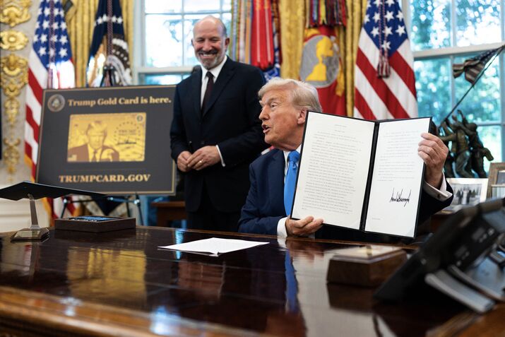 President Donald Trump signs a proclamation instituting a $100,000 fee for visas given to some highly skilled foreign workers in the Oval Office of the White House in Washington, Sept. 19, 2025. (Tierney L. Cross/The New York Times)
