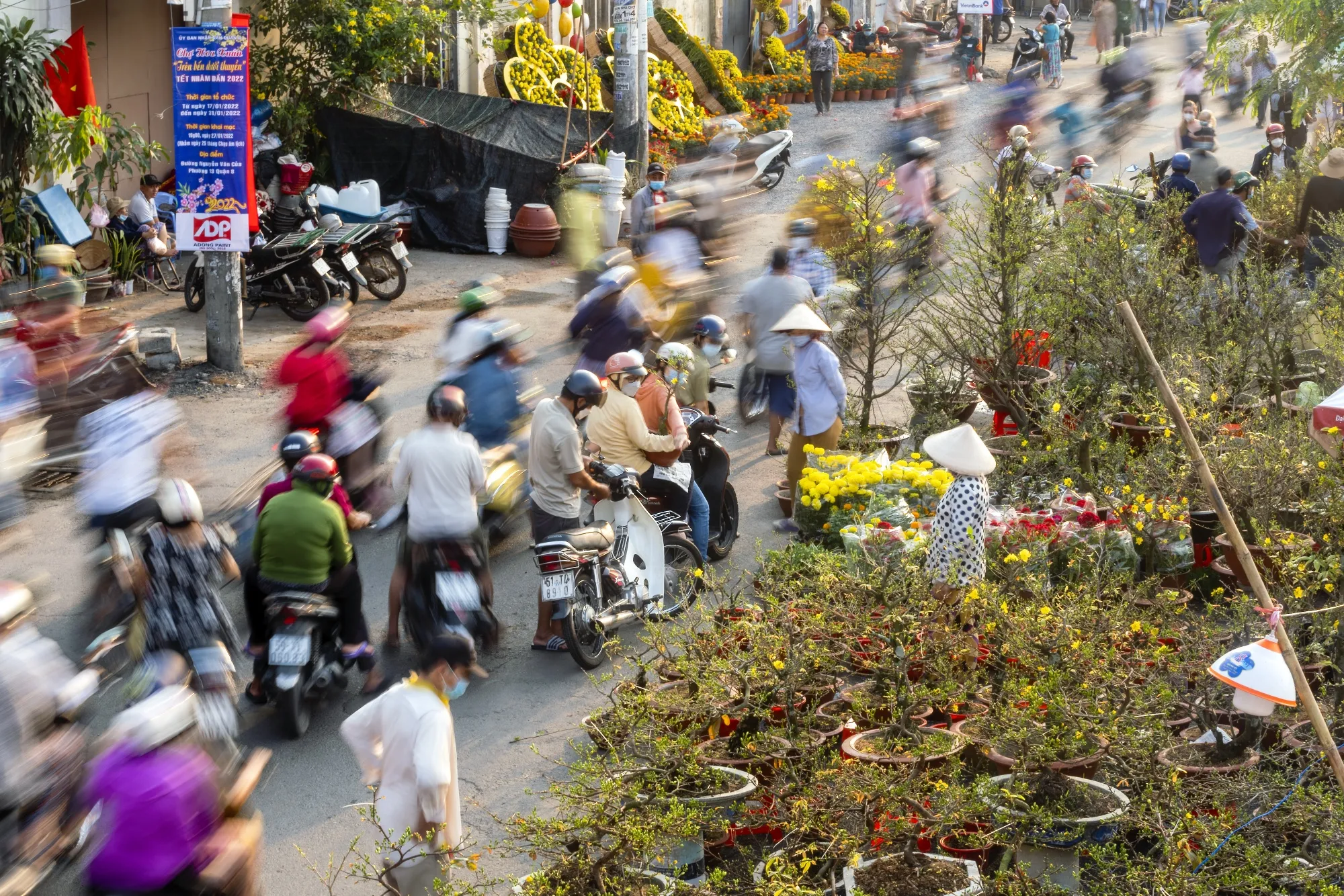 Motorcyclists stop by the flower market at Binh Dong Wharf&nbsp;in Ho Chi Minh City, Vietnam.