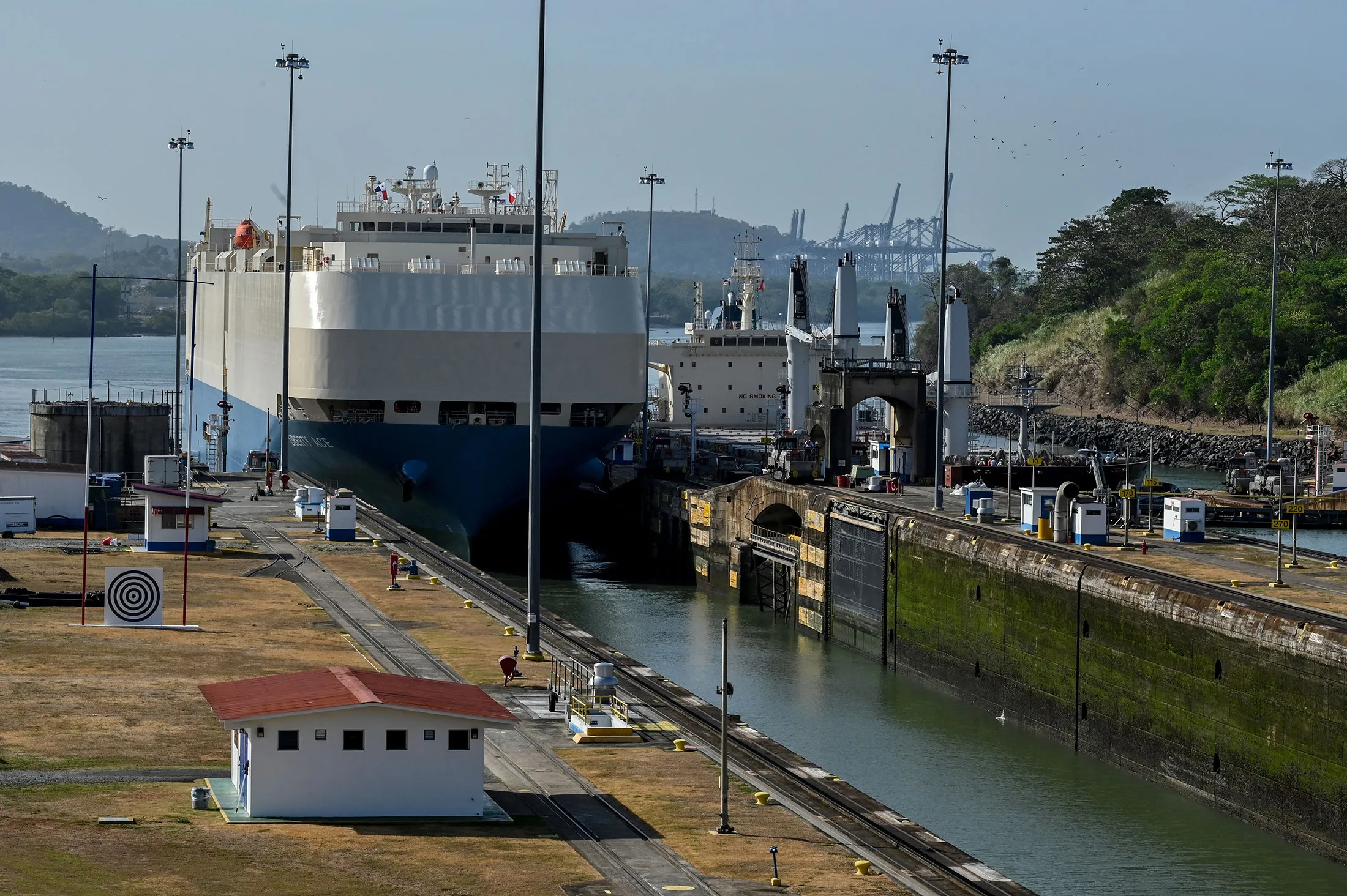 A ship is guided through the Panama Canal’s Miraflores locks near Panama City on April 24.
